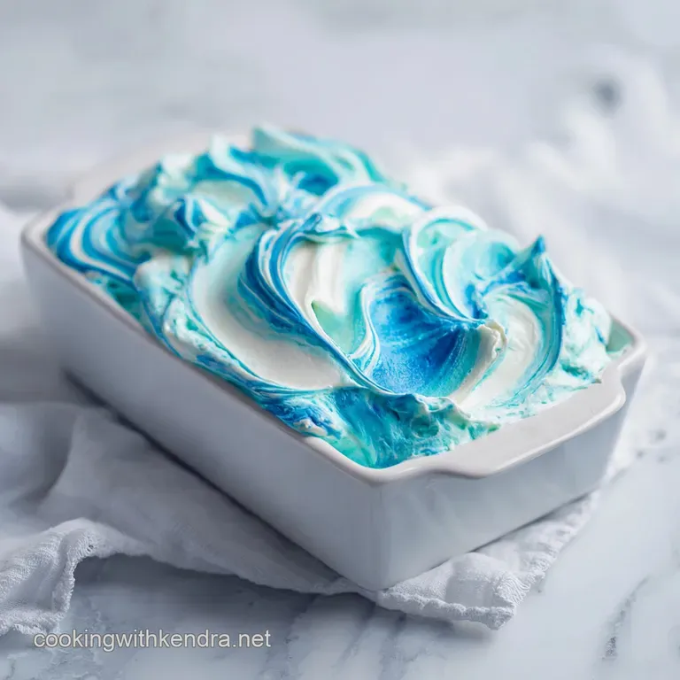 A delicate swirl of white frosting atop a dark chocolate crust, sprinkled with colorful candy.